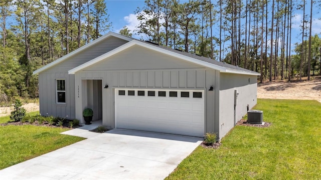 13516 SW 78th Pl, Dunnellon, FL 34432 - view of front of property with board and batten siding, central AC unit, a front yard, and driveway