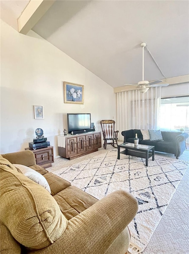 carpeted living room featuring lofted ceiling with beams and ceiling fan