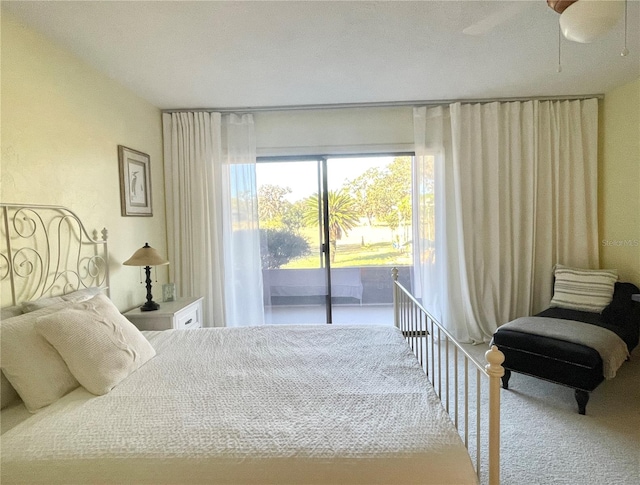 carpeted bedroom featuring access to exterior and ceiling fan