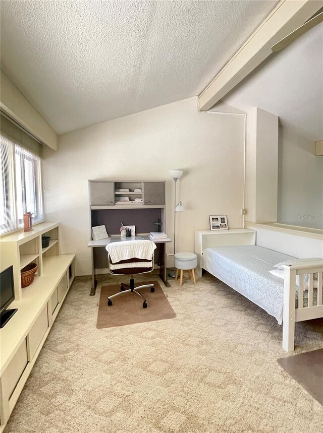 bedroom with light carpet, a textured ceiling, and beamed ceiling