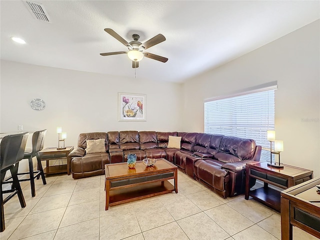 tiled living room with ceiling fan