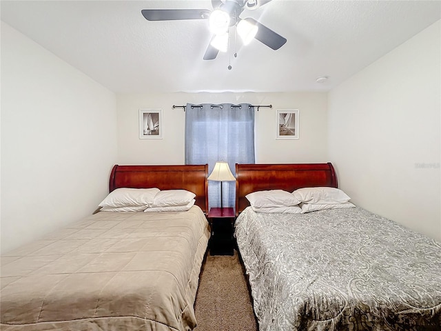 bedroom with ceiling fan and carpet floors