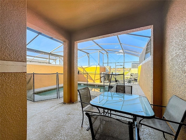 sunroom featuring a healthy amount of sunlight and lofted ceiling