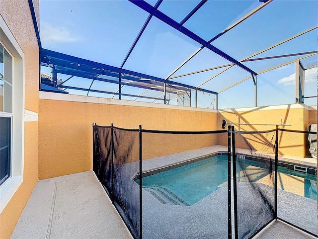 view of swimming pool with a lanai