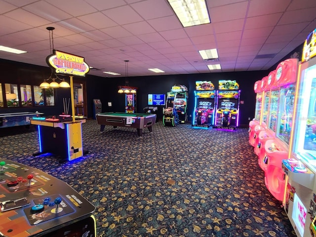 recreation room featuring a drop ceiling, dark carpet, and billiards