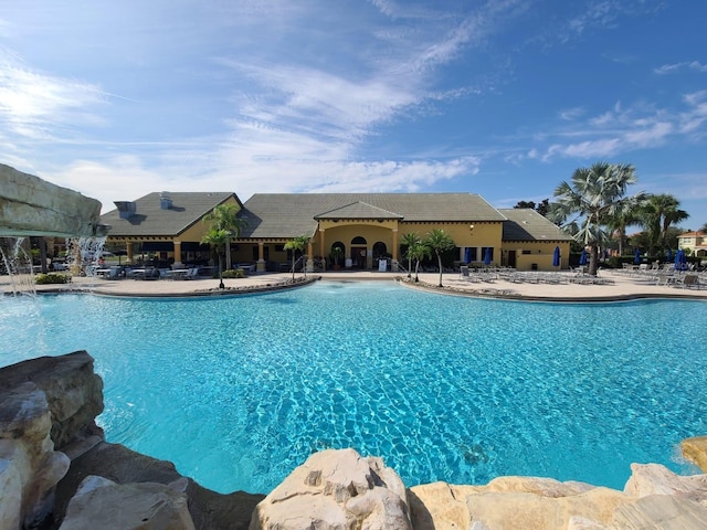 view of swimming pool with a patio area