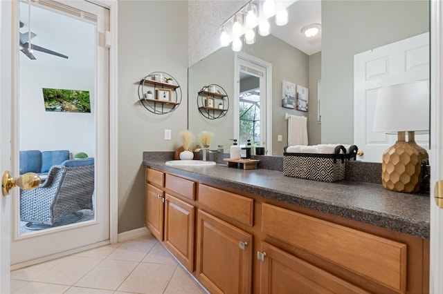 bathroom featuring tile patterned flooring, vanity, and ceiling fan