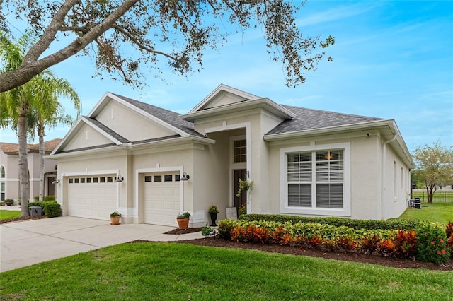 ranch-style house featuring a front lawn and a garage