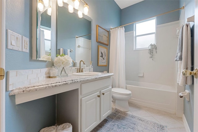 full bathroom with toilet, shower / bath combo, vanity, and tile patterned floors