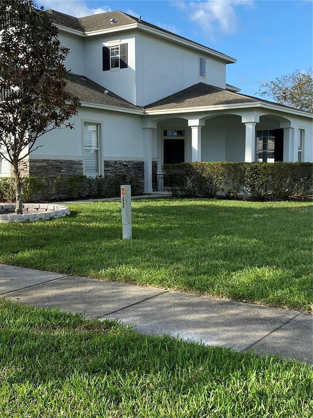 view of front of home featuring a front lawn