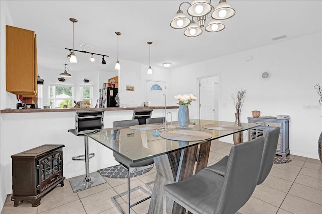 dining space with light tile patterned floors