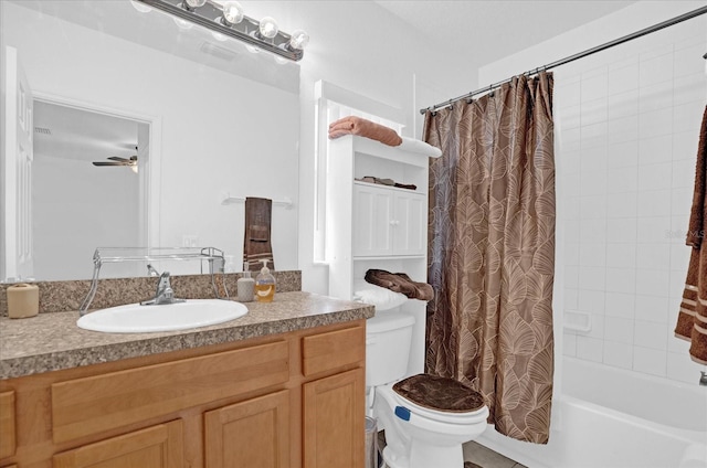 full bathroom featuring vanity, ceiling fan, shower / bathtub combination with curtain, and toilet