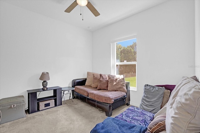 sitting room with light colored carpet and ceiling fan