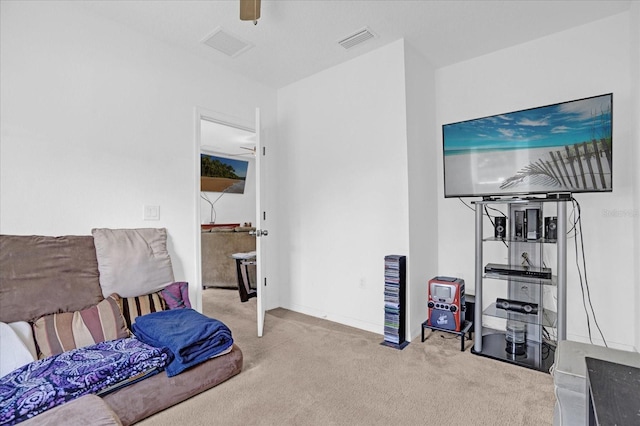 carpeted living room with ceiling fan