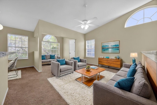 living room featuring light colored carpet, vaulted ceiling, and ceiling fan