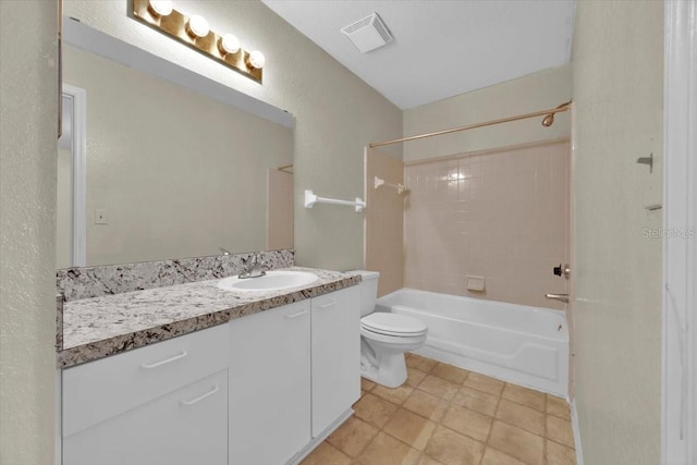 full bathroom with tiled shower / bath combo, toilet, and vanity