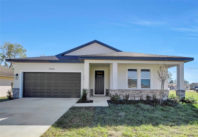 view of front of home with a garage and a front yard