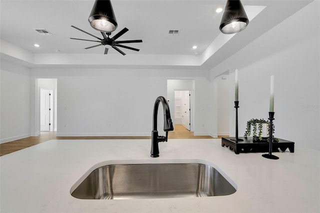 interior space with light hardwood / wood-style floors and sink