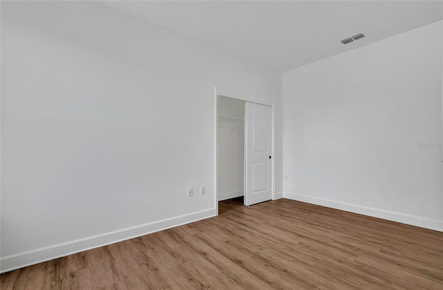 empty room with light wood-type flooring