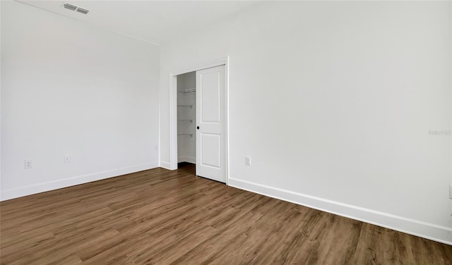 spare room featuring dark hardwood / wood-style floors