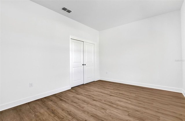 unfurnished room featuring hardwood / wood-style floors