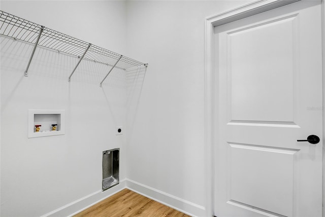 washroom featuring electric dryer hookup, wood-type flooring, and hookup for a washing machine