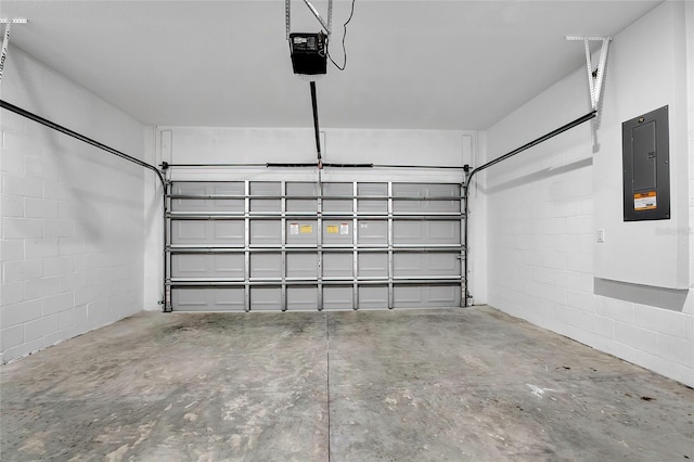 garage with electric panel and a garage door opener