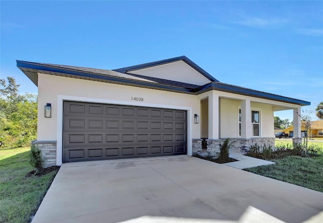 view of front of home with covered porch and a garage