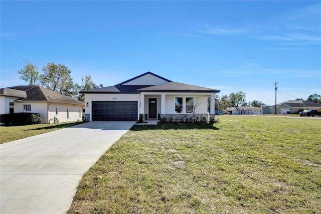 ranch-style home featuring a front lawn and a garage