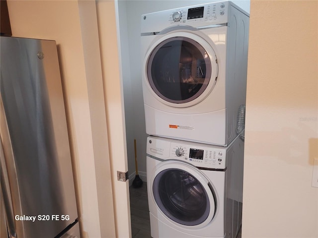 clothes washing area with stacked washer / drying machine