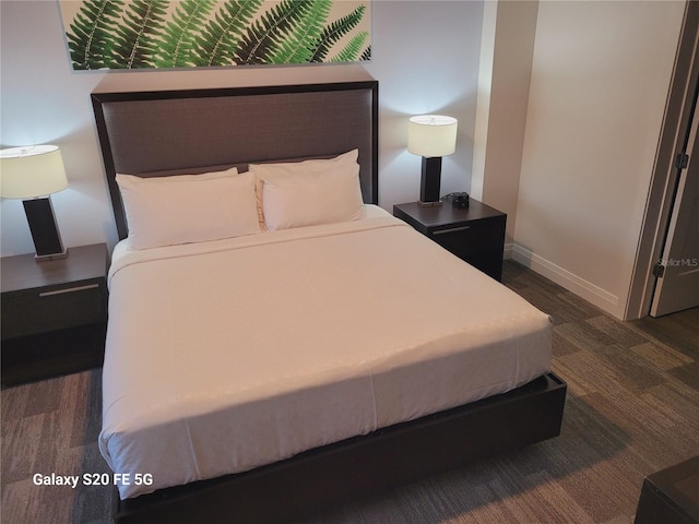 bedroom featuring dark hardwood / wood-style flooring