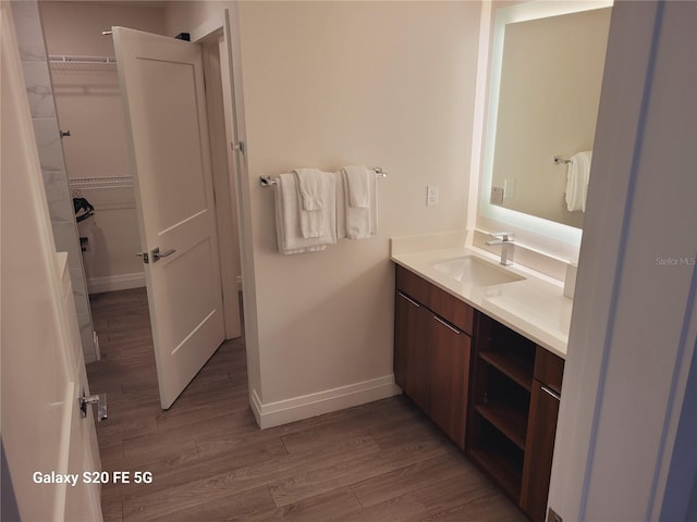 bathroom featuring vanity and wood-type flooring