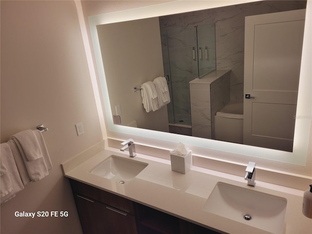 bathroom featuring vanity and tiled shower