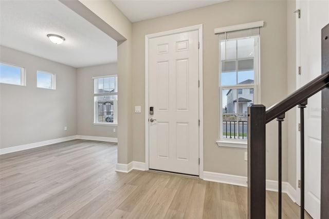 entrance foyer featuring light wood-type flooring