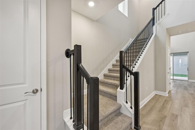 stairway featuring hardwood / wood-style flooring