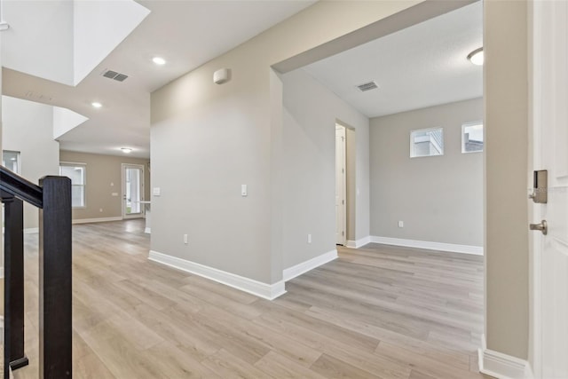 hall with light wood-type flooring