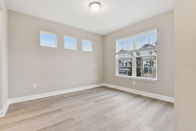 spare room featuring light hardwood / wood-style flooring