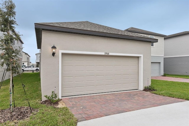 garage featuring a yard