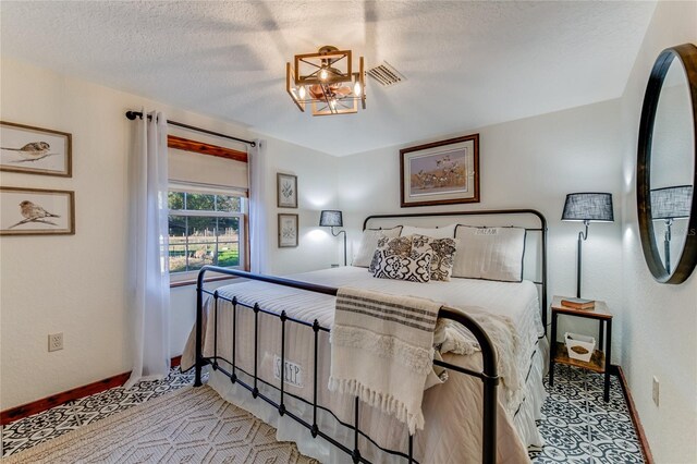 bedroom featuring a textured ceiling