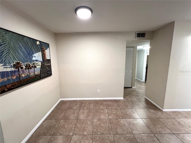 spare room with tile patterned flooring