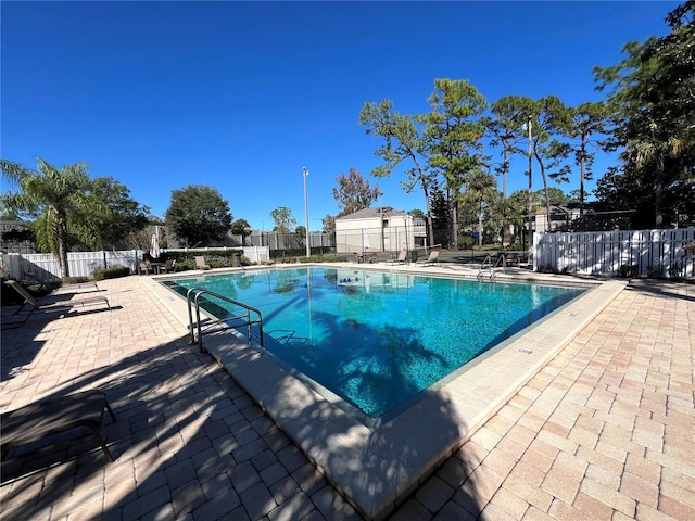 view of swimming pool with a patio