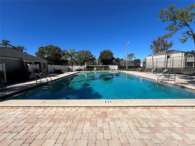 view of swimming pool featuring a patio