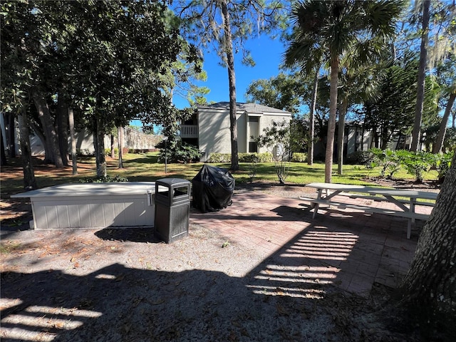 surrounding community featuring a yard and a patio area