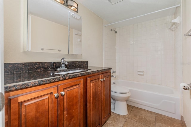 full bathroom with vanity, toilet, tile patterned floors, and tiled shower / bath