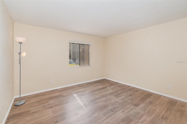 spare room with light hardwood / wood-style floors