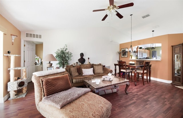 living room featuring lofted ceiling, ceiling fan, and dark wood-type flooring