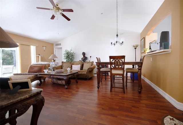 dining space with ceiling fan with notable chandelier, dark hardwood / wood-style flooring, and lofted ceiling