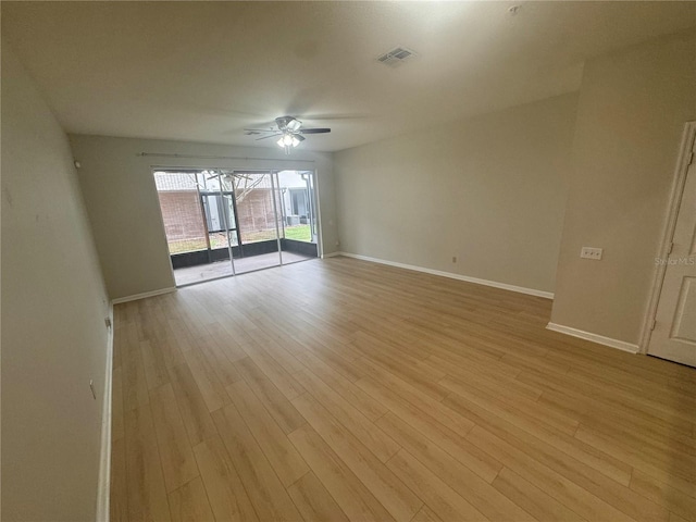 unfurnished room featuring light wood-type flooring and ceiling fan