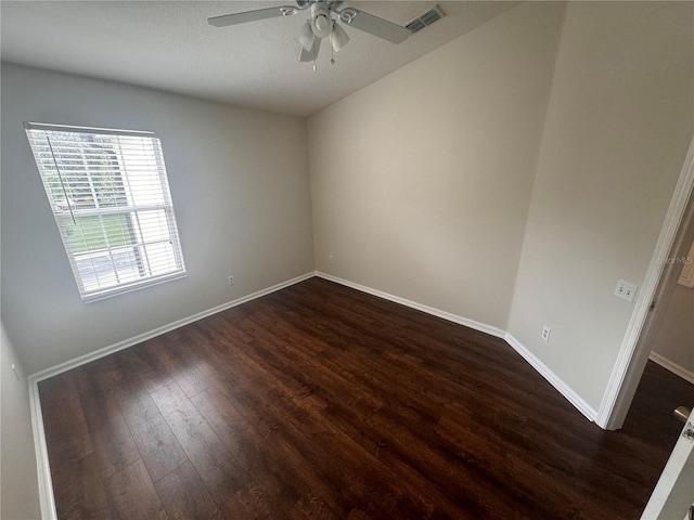 unfurnished room featuring dark hardwood / wood-style flooring and ceiling fan