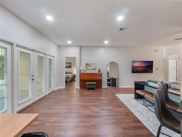 living room featuring french doors and hardwood / wood-style flooring